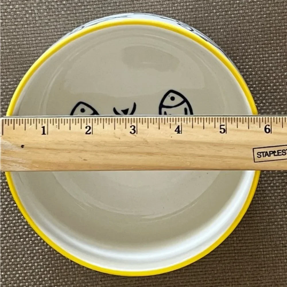 Large Ceramic white bowl with blue fish design. Like new, no scratches or chips.